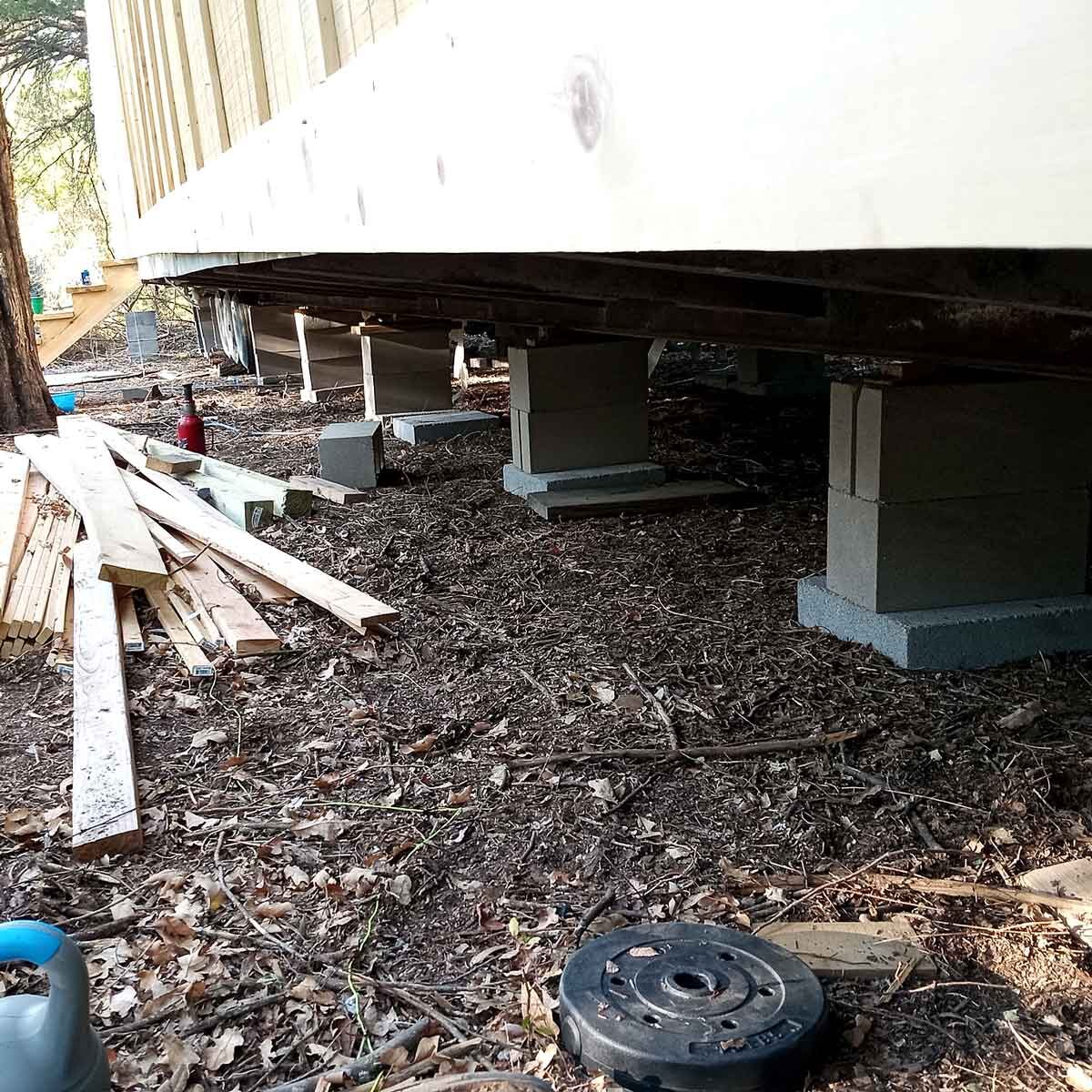 view of leveling blocks under a mobile home